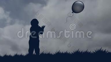 小男孩让<strong>气球</strong>飞向天空。 一个男孩在<strong>气球</strong>的背景下固定的<strong>剪影</strong>